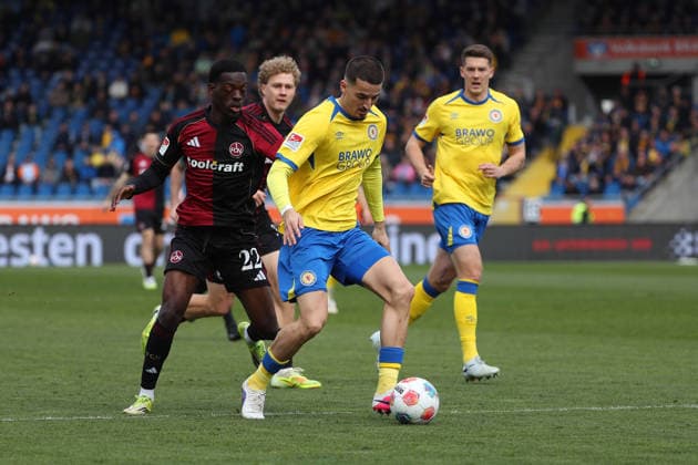 Braunschweig vs Nuremberg 2 BL Braunschweig, 05 04 2026, Football, Men, 2 BL, Season 2025 2026, Eintracht Braunschweig vs 1 FC Nürnberg Rabby Nzingoula 1 FC Nürnberg , Andi Hoti Eintracht Braunschweig DFL DFB REGULATIONS PROHIBIT ANY USE OF PHOTOGRAPHS as IMAGE SEQUENCES and or QUASI VIDEO Stadion an der Hamburger Straße Niedersachsen Germany
