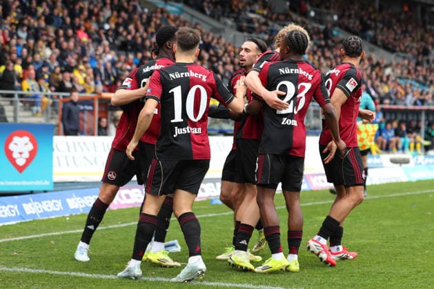 Braunschweig vs Nuremberg 2 BL Braunschweig, 05 04 2026, Football, Men, 2 BL, Season 2025 2026, Eintracht Braunschweig vs 1 FC Nürnberg Rabby Nzingoula 1 FC Nürnberg cheers with teammates after his goal to 0 1 DFL DFB REGULATIONS PROHIBIT ANY USE OF PHOTOGRAPHS as IMAGE SEQUENCES and or QUASI VIDEO Stadion an der Hamburger Straße Niedersachsen Germany
