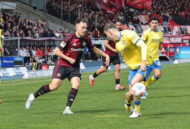 05 04 2026 Soccer Season 2025 2026 2 Soccer Bundesliga 28 Matchday Eintracht Braunschweig BTSV EBS 1 FC Nürnberg FCN Club Sportfoto Zink DaMa xdaxmax DFL regulations prohibit any use of photographs as image sequences and or quasi video only for editorial use Julian Justvan 10, 1 FC Nürnberg FCN Andi Hoti 4, Eintracht Braunschweig BTSV EBS