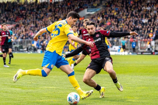 Germany Soccer, 2 Bundesliga, Matchday 28 2025 26, Eintracht Braunschweig 1 FC Nürnberg on 05 04 in Braunschweig, Eintracht Stadion Grant Leon Ranos Eintracht Braunschweig 25 Berkay Yilmaz 1 FC Nürnberg 21 Copyright: xSvenxHeidmannx