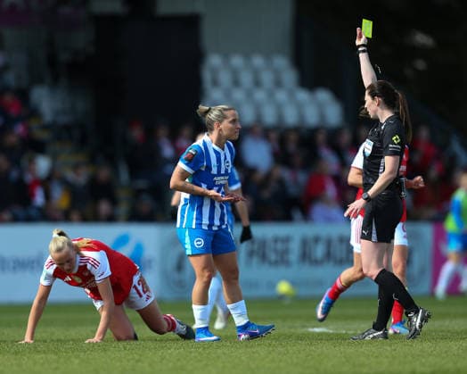 BOREHAMWOOD, ENGLAND - APRIL 05: Abigail Byrne awards a yellow card to Jelena Cankovic of Brighton and Hove Albion for a foul on Frida Leonhardsen Maanum of Arsenal during the Adobe Womens FA Cup match between Arsenal and Brighton and Hove Albion at Mangata Developments Stadium Meadow Park on April 05, 2026 in Borehamwood, England. Copyright: xJayxPatel SPPx Sportspressphoto_SPR124844