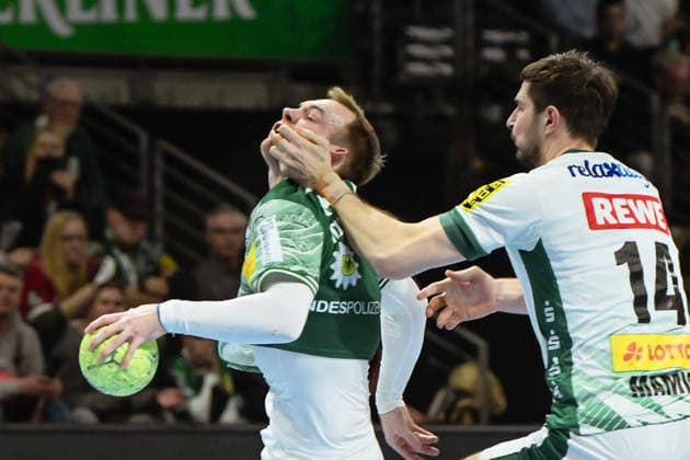 05 04 2026, xlakx, Handball Daikin HBL, Fuechse Berlin SC DHfK Leipzig v l Mathias Gidsel Fuechse Berlin , Marko Mamic SC DHfK Leipzig duel, duel, fight, tackle Berlin Daniel Lakomski