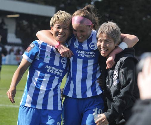 Football - 2025 2026 Adobe Women s FA Cup - Quarter-Final: Arsenal vs. Brighton & Hove Albion - Mangata Devlopments Stadium, Meadow Park, Borehamwood - Sunday 5th April 2026 Goalscorer, Caitlin Hayes of Brighton celebrates after the match with the two Japanese players, Moeka Minami and Kiko Seike 