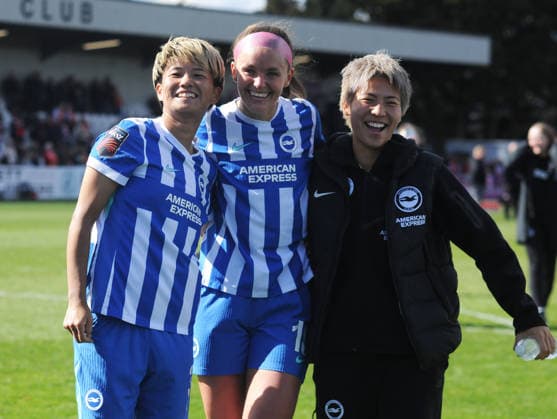 Football - 2025 2026 Adobe Women s FA Cup - Quarter-Final: Arsenal vs. Brighton & Hove Albion - Mangata Devlopments Stadium, Meadow Park, Borehamwood - Sunday 5th April 2026 Goalscorer, Caitlin Hayes of Brighton celebrates after the match with the two Japanese players, Moeka Minami and Kiko Seike 