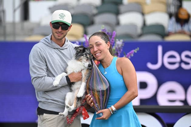 April 5, 2026, Charleston, South Carolina, SC: JESSICA PEGULA of the United States and husband TAYLOR GAHAGEN pose with their dog and the championship trophy following Pegulas win against YULIIA STARODUBTSEVA of Ukraine in the final match of the Credit One Charleston Open at Credit One Stadium on April 3rd, 2026 in Charleston, SC. Tennis 2026: Charleston Open Finals  - ZUMAv134 20260405_zsp_v134_044 Copyright: xMaxwellxVittoriox