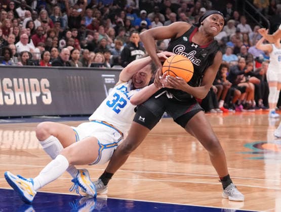 UCLA forward Angela Dugalic (32) fights for the ball with South Carolina guard Raven Johnson (25) in the first half of the Finals of the 2026 NCAA, College League, USA Women s Basketball Tournament at Mortgage Matchup Center in Phoenix, Arizona, on Sunday, April 5, 2026.  AZP20260405919 DARRYLxWEBB