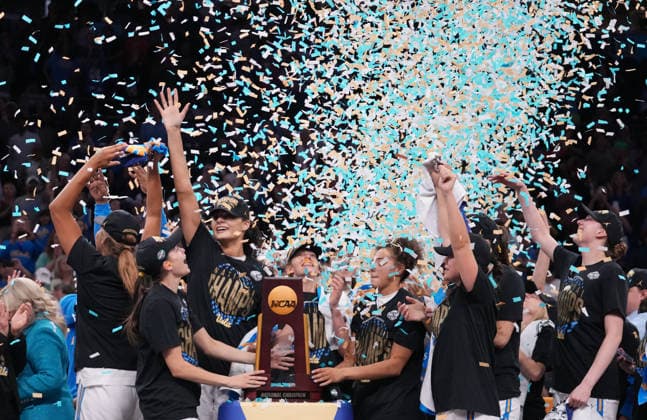 UCLA players celebrate after defeating South Carolina in the Finals of the 2026 NCAA, College League, USA Women s Basketball Tournament at Mortgage Matchup Center in Phoenix, Arizona, on Sunday, April 5, 2026. UCLA defeated South Carolina 79-51 to win their first-ever women s NCAA Tournament championship.  AZP20260405972 DARRYLxWEBB