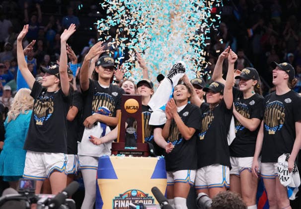 UCLA players celebrate after defeating South Carolina in the Finals of the 2026 NCAA, College League, USA Women s Basketball Tournament at Mortgage Matchup Center in Phoenix, Arizona, on Sunday, April 5, 2026. UCLA defeated South Carolina 79-51 to win their first-ever women s NCAA Tournament championship.  AZP20260405979 DARRYLxWEBB