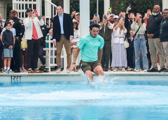 HOUSTON, TX - APRIL 05: Andres Andrade (ECU) jumps in the pool as part of the victory tradition after the doubles finals of the Men™s Clay Court Championship on April 5, 2026 at River Oaks Country Club in Houston, Texas. (Photo by Leslie Plaza Johnson Icon Sportswire) TENNIS: APR 05 US Men s Clay Court Championship EDITORIAL USE ONLY Icon260405110