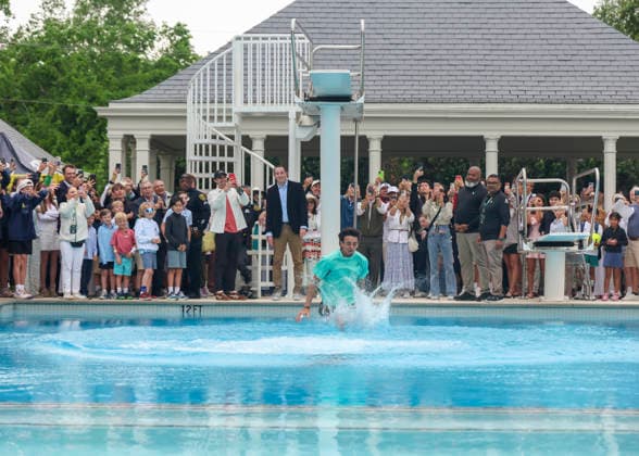 HOUSTON, TX - APRIL 05: Andres Andrade (ECU) jumps in the pool as part of the victory tradition after the doubles finals of the Men™s Clay Court Championship on April 5, 2026 at River Oaks Country Club in Houston, Texas. (Photo by Leslie Plaza Johnson Icon Sportswire) TENNIS: APR 05 US Men s Clay Court Championship EDITORIAL USE ONLY Icon260405111