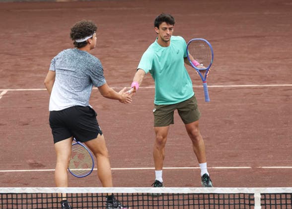 HOUSTON, TX - APRIL 05: (left to right) Ben Shelton (USA) and Andres Andrade (ECU) high five each other during the doubles finals of the Men™s Clay Court Championship on April 5, 2026 at River Oaks Country Club in Houston, Texas. (Photo by Leslie Plaza Johnson Icon Sportswire) TENNIS: APR 05 US Men s Clay Court Championship EDITORIAL USE ONLY Icon260405031