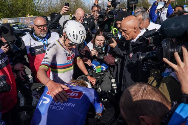 (260406) -- HAALTERT, April 6, 2026 -- UAE Team Emirates Slovenian rider Tadej Pogacar (L) greets Alpecin-Premier Tech s Dutch rider Mathieu van der Poel reacts after the Tour of Flanders cycling race in Haaltert on April 5, 2026. ) (SP)BELGIUM-HAALTERT-CYCLING-TOUR OF FLANDERS PengxZiyang 