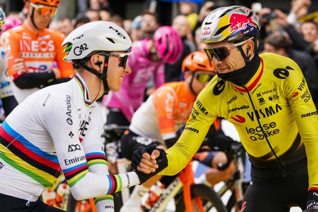 (260406) -- HAALTERT, April 6, 2026 -- UAE Team Emirates Slovenian rider Tadej Pogacar (L) greets Team Visma Lease a Bike s Belgian rider Wout van Aert before the Tour of Flanders cycling race in Haaltert on April 5, 2026. ) (SP)BELGIUM-HAALTERT-CYCLING-TOUR OF FLANDERS PengxZiyang 