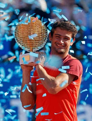 (260406) -- BUCHAREST, April 6, 2026 -- Mariano Navone of Argentina celebrates with the trophy after winning the final match against Daniel Merida of Spain at the ATP, Tennis Herren 250 Tiriac Open tennis tournament in Bucharest, Romania, April 5, 2026. (Photo by Xinhua) (SP)ROMANIA-BUCHAREST-TENNIS-ATP 250 TIRIAC OPEN CristianxCristel 