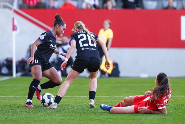 Vanessa Fürst 8, SGS Essen and Lany Mia Bäcker 26, SGS Essen clear in front of Natalia Padilla Bidas 23, FC Bayern München during the match between FC Bayern München v SGS Essen, Football, Women, DFB Pokal Women, 2025 2026, Semi Final on 06 04 2026 in Munich, FC Bayern Campus Bayern Germany