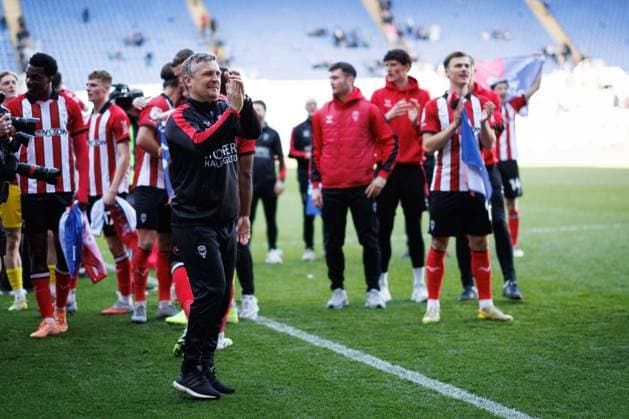 Michael Skubala manager of Lincoln City and Lincoln City players celebrate their promotion to the Sky Bet Championship Reading v Lincoln City, Sky Bet League One, Football, Select Car Leasing Stadium, Reading, UK - 06 Apr 2026Reading Select Car Leasing Stadium United Kingdom EDITORIAL USE ONLY No use with unauthorised audio, video, data, fixture lists, club league logos or live services. Online in-match use limited to 120 images, no video emulation. No use in betting, games or single club league player publications. Copyright: xSimonxDael Shutterstockx 16811828bx