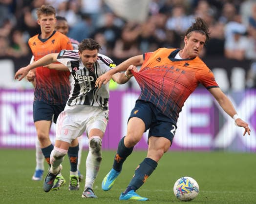 Turin, Italy, 6th April 2026. Lorenzo Colombo of Genoa CFC shields the ball from Manuel Locatelli of Juventus during the Juventus vs Genoa Serie A match at Allianz Stadium, Turin. Picture credit should read: Jonathan Moscrop Sportimage EDITORIAL USE ONLY. No use with unauthorised audio, video, data, fixture lists, club league logos or live services. Online in-match use limited to 120 images, no video emulation. No use in betting, games or single club league player publications. SPI_012_JM_JUVE_GENOA SPI-4644-0012