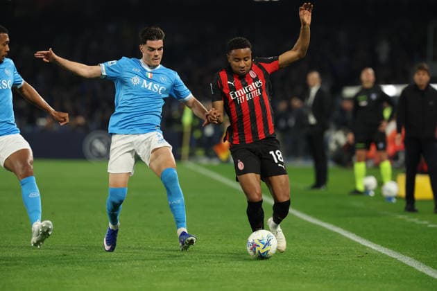 AC Milan s Christopher Nkunku, Napoli™s Miguel Gutierrez during the Serie A soccer match between Napoli and Milan at the Diego Armando Maradona Stadium in Naples, southern italy - Monday , April 06 , 2026. - Soccer .  Copyright: xAlessandroxGarofalo LaPressex