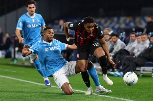 Juan Jesus of SSC Napoli and Christopher Nkunku of AC Milan compete for the ball during the Serie A 2025 2026 football match between SSC Napoli and AC Milan at Diego Armando Maradona stadium in Naples (Italy), April 06th, 2026. CesarexPurini