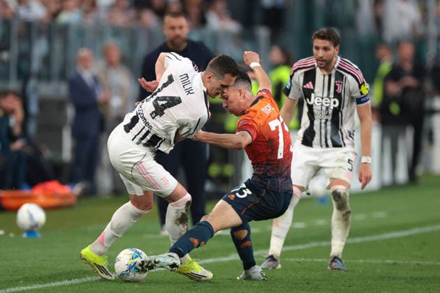 Turin, Italy, 6th April 2026. Manuel Locatelli of Juventus looks on as Patrizio Masini of Genoa CFC dispossesses team mate Arkadiusz Milik during the Juventus vs Genoa Serie A match at Allianz Stadium, Turin. Picture credit should read: Jonathan Moscrop Sportimage EDITORIAL USE ONLY. No use with unauthorised audio, video, data, fixture lists, club league logos or live services. Online in-match use limited to 120 images, no video emulation. No use in betting, games or single club league player publications. SPI_079_JM_JUVE_GENOA SPI-4644-0079