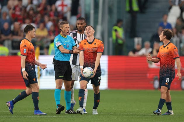 Turin, Italy, 6th April 2026. The Referee Davide Massa grabs Patrizio Masini of Genoa CFC as he reacts along with team mates Vitinha and Tommaso Baldanzi after a free kick was awarded against him for a foul on Khephren Thuram of Juventus whom looks on during the Juventus vs Genoa Serie A match at Allianz Stadium, Turin. Picture credit should read: Jonathan Moscrop Sportimage EDITORIAL USE ONLY. No use with unauthorised audio, video, data, fixture lists, club league logos or live services. Online in-match use limited to 120 images, no video emulation. No use in betting, games or single club league player publications. SPI_097_JM_JUVE_GENOA SPI-4644-0097