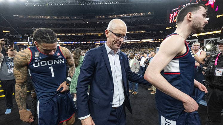 April 6, 2026, Indianapolis, Indiana, USA: UConn head coach Dan Hurley along with Solo Ball and Alex Karaban walk off the court moments after the Huskies lost to Michigan for the NCAA, College League, USA Mens Basketball Championship, 69-63. Monday, April 7, 2026. Indianapolis USA - ZUMAr44_ 20260406_zsp_r44_001 Copyright: xThomasxJ.xRussox