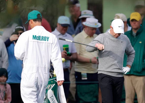 Rory McIlroy of Northern Ireland chooses a club for his approach shot to the 7th green during a practice round on the Tuesday before The Masters Tournament at Augusta National Golf Club on Tuesday, April 7, 2026 in Augusta, Georgia.  AUG20260407103 JOHNxANGELILLO