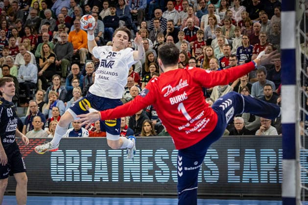 FLENSBURG, GERMANY - APRIL 7: Alexander Laur Risum Krog Jensen (SAH - Aarhus, 05) against Benjamin Buric (SG Flensburg-Handewitt, 01) during the EHF European League Play-Offs Return Leg between SG Flensburg-Handewitt vs SAH - Aarhus at GP JOULE Arena on April 7, 2026 in Flensburg, Germany. Schleswig-Holstein Germany Copyright: xMarioxM.xKobergx
