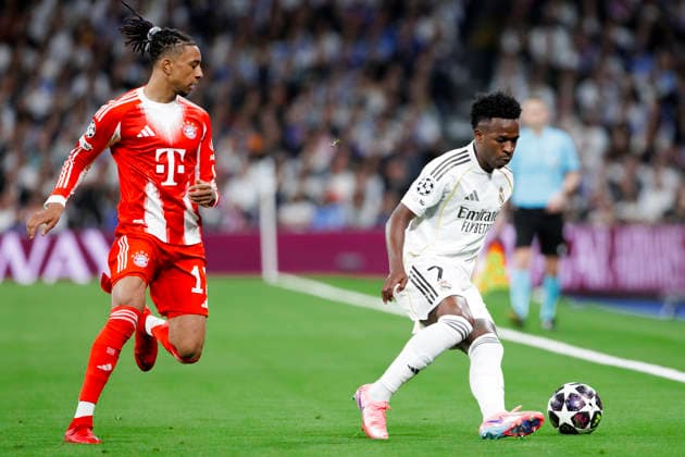 UEFA champions league - Real Madrid vs Bayern Munchen MADRID, SPAIN - April 7:Vinicius Jr of Real Madrid and Michael Olise of Bayern Munich in action during the UEFA champions league 2025 26 Quarter-finals first leg match between Real Madrid and Bayern Munchen at Santiago Bernabeu Stadium. (Photo by Guille Martinez f22photo) Madrid Santiago Bernabeu Stadium Spain Copyright: xGuillermoxMartinezx