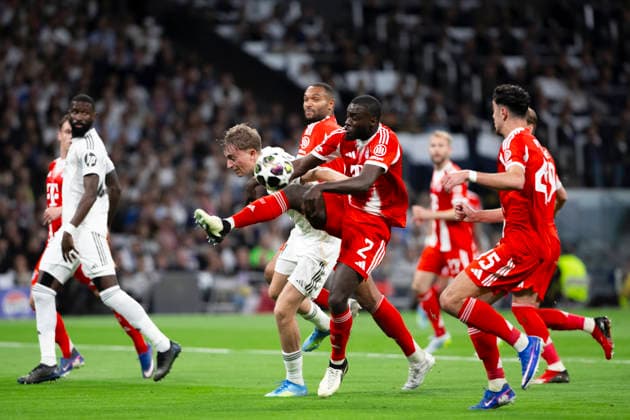 UEFA champions league - Real Madrid vs Bayern Munchen MADRID, SPAIN - April 7:Dayot Upamecano of Bayern Munich and Dean Huijsen of Real Madrid in action during the UEFA champions league 2025 26 Quarter-finals first leg match between Real Madrid and Bayern Munchen at Santiago Bernabeu Stadium. (Photo by Guille Martinez f22photo) Madrid Santiago Bernabeu Stadium Spain Copyright: xGuillermoxMartinezx