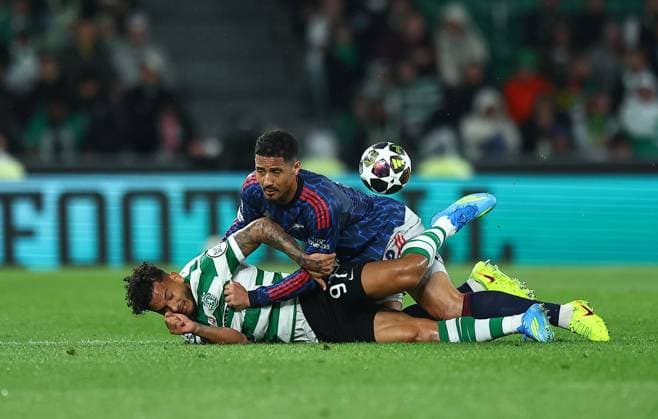 William Saliba of Arsenal competes for the ball with Luis Suarez of Sporting Sporting v Arsenal, UEFA Champions League, Quarter Final, First Leg, Football, Estadio Jose Alvalade, Lisbon, Portugal - 07 Apr 2026Lisbon Estádio José Alvalade Portugal EDITORIAL USE ONLY No use with unauthorised audio, video, data, fixture lists, club league logos or live services. Online in-match use limited to 120 images, no video emulation. No use in betting, games or single club league player publications.  Copyright: xMichaelxZemanek Shutterstockx 16811860k