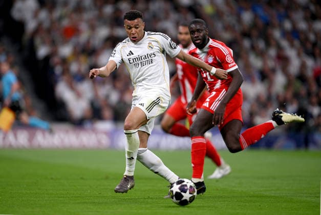 FOOTBALL CHAMPIONS LEAGUE SEASON 2025 2026 Quarter-final first leg 07 04 2026 Real Madrid FC Bayern Muenchen Kylian Mbappe left, Real Madrid v Dayot Upamecano right, FC Bayern Muenchen