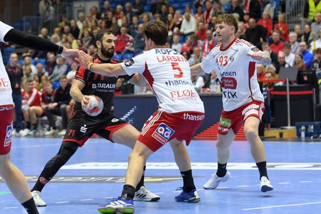 Mohamed Amine Darmoul MT Melsungen 71 on the ball , Kristian Huebert Larsen Fredericia HK 5 , Anders Kragh Martinusen Fredericia HK 93 R , GER, MT Melsungen Fredericia HK DEN , Handball, EHF European League Men, Play Offs, Season 2025 2026, 07 04 2026, GER, MT Melsungen Fredericia HK, Handball, EHF Men, Play Off, Season 2025 2026, 07 04 2026 Kassel Copyright: xEibner-Pressefotox xRolandxSippex EP_RSL