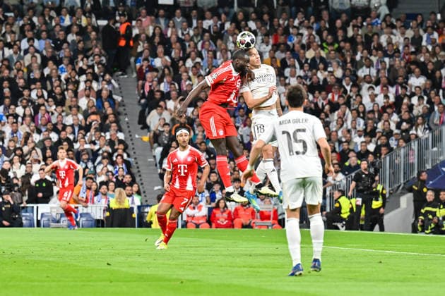 MADRID, SPAIN - 07. APRIL: header between Dayot UPAMECANO (FC Bayern Munich 2) and Alvaro CARRERAS (Real Madrid 18) during the UEFA Champions League match between Real Madrid vs. FC Bayern Munich on Quarterfinal first leg at Estadio Santiago Bernabeu Copyright: xBEAUTIFULxSPORTS Goldbergx
