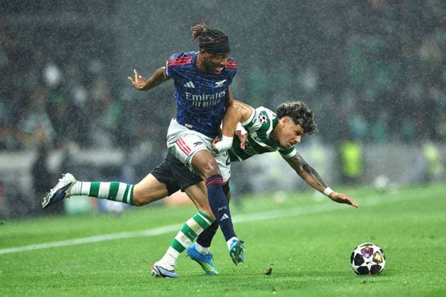 Noni Madueke of Arsenal competes for the ball with Maxi Araujo of Sporting Sporting v Arsenal, UEFA Champions League, Quarter Final, First Leg, Football, Estadio Jose Alvalade, Lisbon, Portugal - 07 Apr 2026Lisbon Estádio José Alvalade Portugal EDITORIAL USE ONLY No use with unauthorised audio, video, data, fixture lists, club league logos or live services. Online in-match use limited to 120 images, no video emulation. No use in betting, games or single club league player publications.  Copyright: xMichaelxZemanek Shutterstockx 16811860r