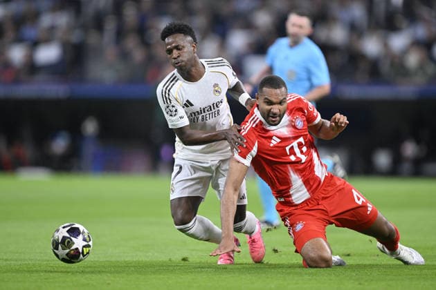 Real Madrid v Bayern Munich - UEFA Champions League MADRID, SPAIN - APRIL 7: Vinicius Junior (L) of Real Madrid in action against Jonathan Tah (R) of Bayern Munich during UEFA Champions League quarterfinals first leg match between Real Madrid and Bayern Munich at Bernabeu Stadium in Madrid, Spain on April 7, 2026. Burak Akbulut Anadolu Madrid Spain. Editorial use only. Please get in touch for any other usage.  Copyright: x2026xAnadoluxBurakxAkbulutx
