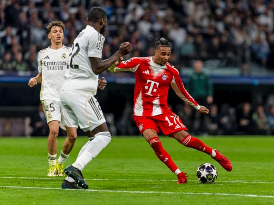 07 04 2026, Football UEFA Champions League 2025 2026 quarter-final, Real Madrid FC Bayern Munich, at Estadio Bernabeu in Madrid Spain , re Michael Olise FC Bayern Munich shot against Antonio Rüdiger Real Madrid