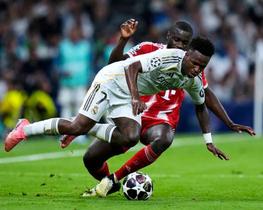 ESP: Real Madrid v Bayern Munich. UEFA Champions League. Quarter-Finals, First Leg. Vinicius Junior of Real Madrid CF and Dayot Upamecano of FC Bayern Munchen during the UEFA Champions League match, between Real Madrid and Bayern Munich, Quarter-Finals, first leg, played at Santiago Bernabeu Stadium on April 7, 2026 in Madrid, Spain. Copyright: xCesarxCebollax xPRESSINPHOTOx PS_260407_RMA_BAY_2526_123