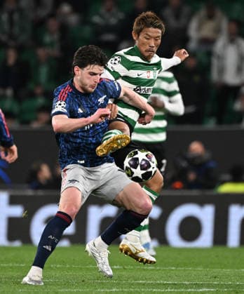 Sporting v Arsenal - UEFA Champions League LISBON, PORTUGAL - APRIL 07: Declan Rice of Arsenal and Hidemasa Morita of Sporting challenge for the ball during the UEFA Champions League 2025 26 Quarter-Final First Leg match between Sporting Clube de Portugal and Arsenal FC at Estadio Jose Alvalade on April 07, 2026 in Lisbon, Portugal. Alex Juarez Anadolu Lisbon Portugal. Editorial use only. Please get in touch for any other usage.  Copyright: x2026xAnadoluxAlexxJuarezx
