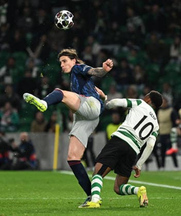 Sporting v Arsenal - UEFA Champions League LISBON, PORTUGAL - APRIL 07: Riccardo Calafiori of Arsenal and Geny Catamo of Sporting challenge for the ball during the UEFA Champions League 2025 26 Quarter-Final First Leg match between Sporting Clube de Portugal and Arsenal FC at Estadio Jose Alvalade on April 07, 2026 in Lisbon, Portugal. Alex Juarez Anadolu Lisbon Portugal. Editorial use only. Please get in touch for any other usage.  Copyright: x2026xAnadoluxAlexxJuarezx