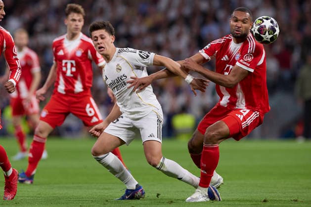 April 7, 2026, Madrid, Spain: Arda Guler (L) of Real Madrid CF and Jonathan Tah (R) of FC Bayern Munchen are seen in action during the UEFA Champions League 2025 2026 quarter-finals first leg football match between Real Madrid CF and FC Bayern Munchen at Santiago Bernabeu stadium. Final score Real Madrid CF 1:2 FC Bayern Munchen Madrid Spain - ZUMAs197 20260407_aaa_s197_201 Copyright: xFedericoxTitonex