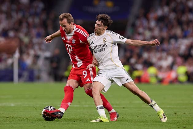 April 7, 2026, Madrid, Spain: Harry Kane (L) of FC Bayern Munchen and Thiago Pitarch (R) of Real Madrid CF are seen in action during the UEFA Champions League 2025 2026 quarter-finals first leg football match between Real Madrid CF and FC Bayern Munchen at Santiago Bernabeu stadium. Final score Real Madrid CF 1:2 FC Bayern Munchen Real Madrid CF Vs FC Bayern Munchen In Madrid - 07 Apr 2026  - ZUMAs197 20260407_aaa_s197_207 Copyright: xFedericoxTitonex