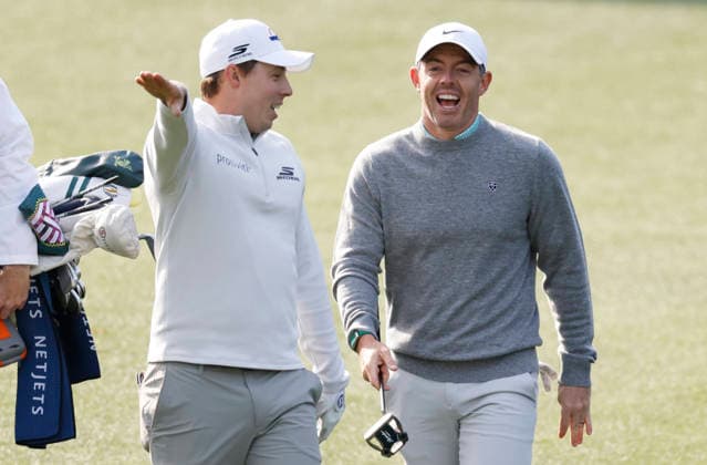 Rory McIlroy of Northern Ireland and Matt Fitzpatrick of England react after skipping golf balls off of the water in front of the 16th green during a practice round on the Wednesday before The Masters Tournament at Augusta National Golf Club on Wednesday, April 8, 2026 in Augusta, Georgia.  AUG20260408112 JOHNxANGELILLO