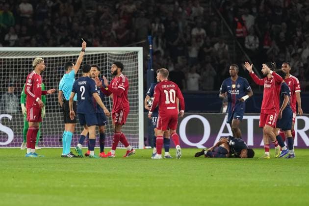 Joe Gomez of Liverpool receives a yellow card for a foul on Desire Doue of PSG Paris Saint-Germain v Liverpool, UEFA Champions League, Quarter Final, First Leg, Football, Parc des Princes, Paris, France - 08 Apr 2026Paris Parc des Princes France EDITORIAL USE ONLY No use with unauthorised audio, video, data, fixture lists, club league logos or live services. Online in-match use limited to 120 images, no video emulation. No use in betting, games or single club league player publications.  Copyright: xDavexWinter Shutterstockx 16811861be