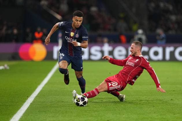Alexis Mac Allister of Liverpool receives a yellow card for a foul on Desire Doue of PSG Paris Saint-Germain v Liverpool, UEFA Champions League, Quarter Final, First Leg, Football, Parc des Princes, Paris, France - 08 Apr 2026Paris Parc des Princes France EDITORIAL USE ONLY No use with unauthorised audio, video, data, fixture lists, club league logos or live services. Online in-match use limited to 120 images, no video emulation. No use in betting, games or single club league player publications.  Copyright: xDavexWinter Shutterstockx 16811861bg