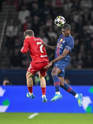 Florian Wirtz Liverpool FC and Nuno Mendes Paris Saint Germain FC battle for the ball during the UEFA Champions League 2025 26 Quarter Final First Leg match between Paris Saint Germain FC and Liverpool FC at Parc des Princes on April 8, 2026 in Paris, France Photo by Harry Langer DeFodi Images