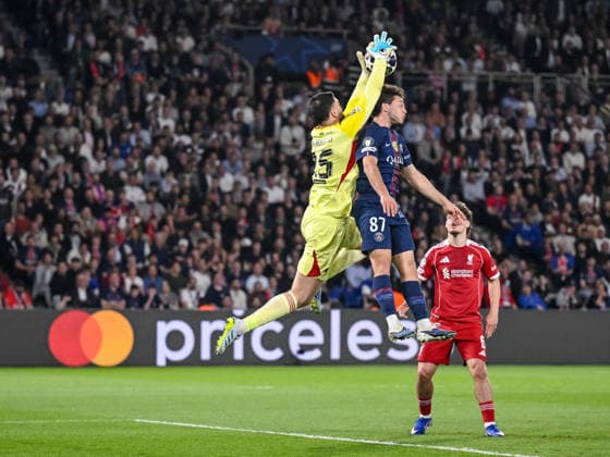 Goalkeeper Giorgi Mamardashvili Liverpool FC , Joao Neves Paris Saint Germain FC and Milos Kerkez Liverpool FC battle for the ball during the UEFA Champions League 2025 26 Quarter Final First Leg match between Paris Saint Germain FC and Liverpool FC at Parc des Princes on April 8, 2026 in Paris, France Photo by Harry Langer DeFodi Images