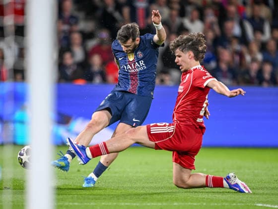 Khvicha Kvaratskhelia Paris Saint Germain FC and Milos Kerkez Liverpool FC battle for the ball during the UEFA Champions League 2025 26 Quarter Final First Leg match between Paris Saint Germain FC and Liverpool FC at Parc des Princes on April 8, 2026 in Paris, France Photo by Harry Langer DeFodi Images