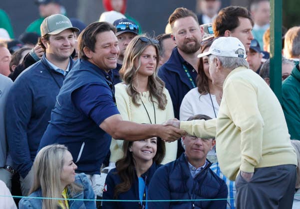 Golfing legend Jack Nicklaus greets Florida Governor Ron DeSantis during the opening ceremony before the start of the first day of the Masters Tournament at Augusta National Golf Club on Thursday, April 9, 2026, in Augusta, Georgia.  AUG20260409813 JOHNxANGELILLO