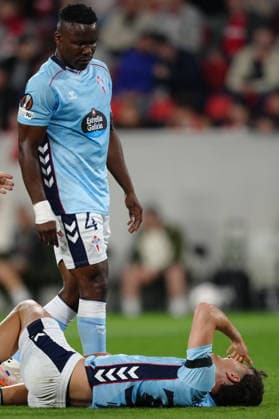 Germany UEFA Europa League quarter-final first leg 2025 26, SC Freiburg vs Celta Vigo Europa Park Stadion, Freiburg im Breisgau Joseph Aidoo 4 Celta looks on Javi Rodriguez 32 Celta who lies injured on the ground Copyright: xKjetilxWaberx